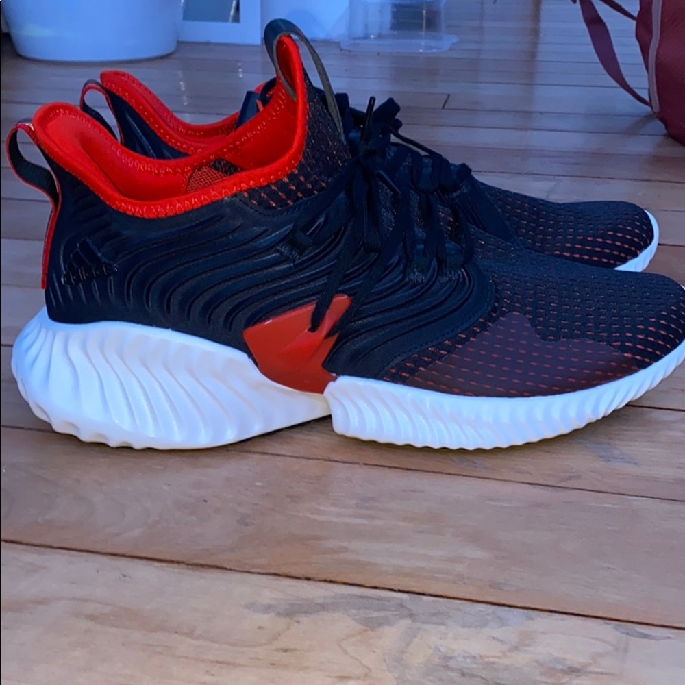 Black and red addidas sneakers